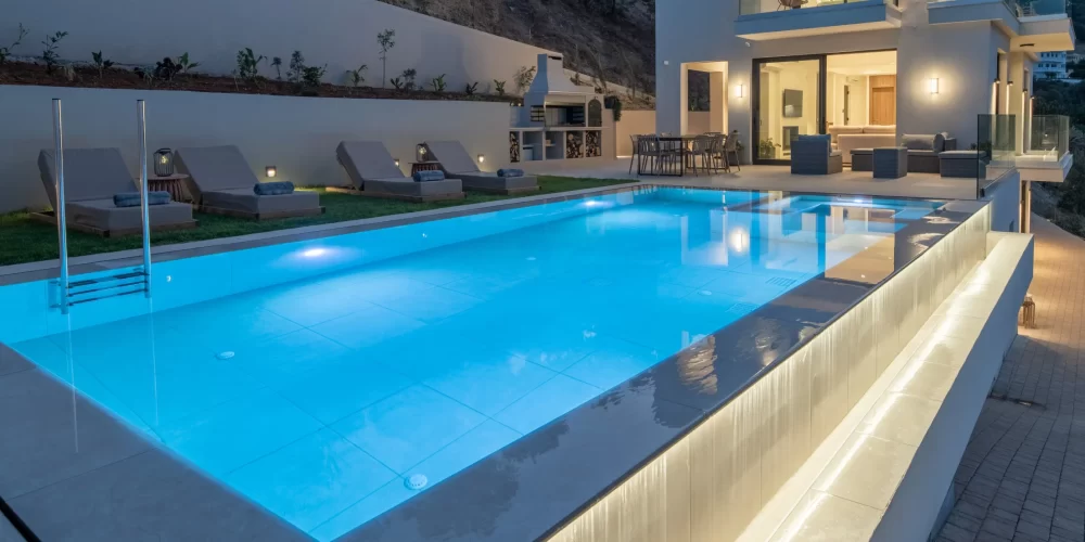 Villa Vie. Exterior with pool waterfall